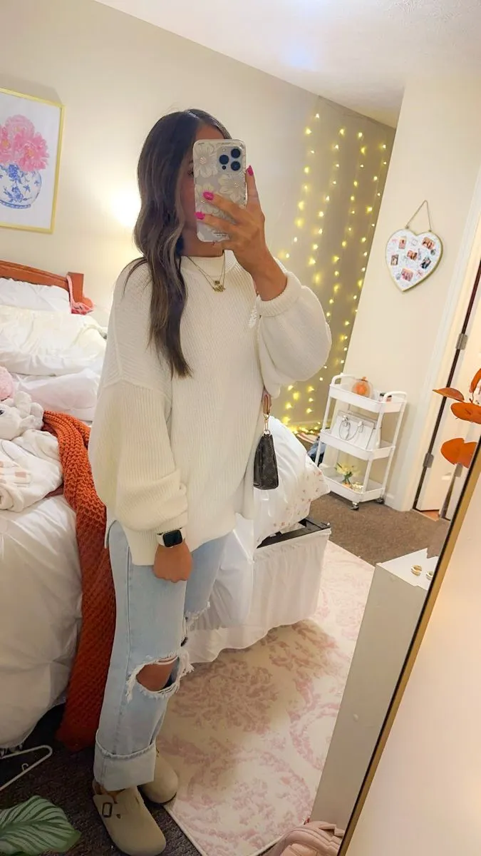 Cute outfits with jeans with a cozy white sweater and light wide leg jeans
