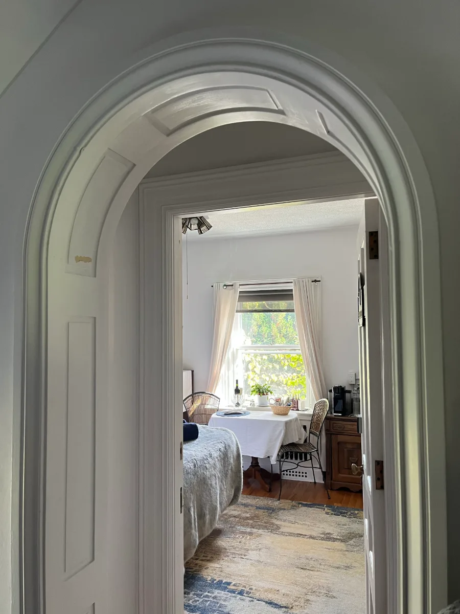 arched doorway into a bedroom