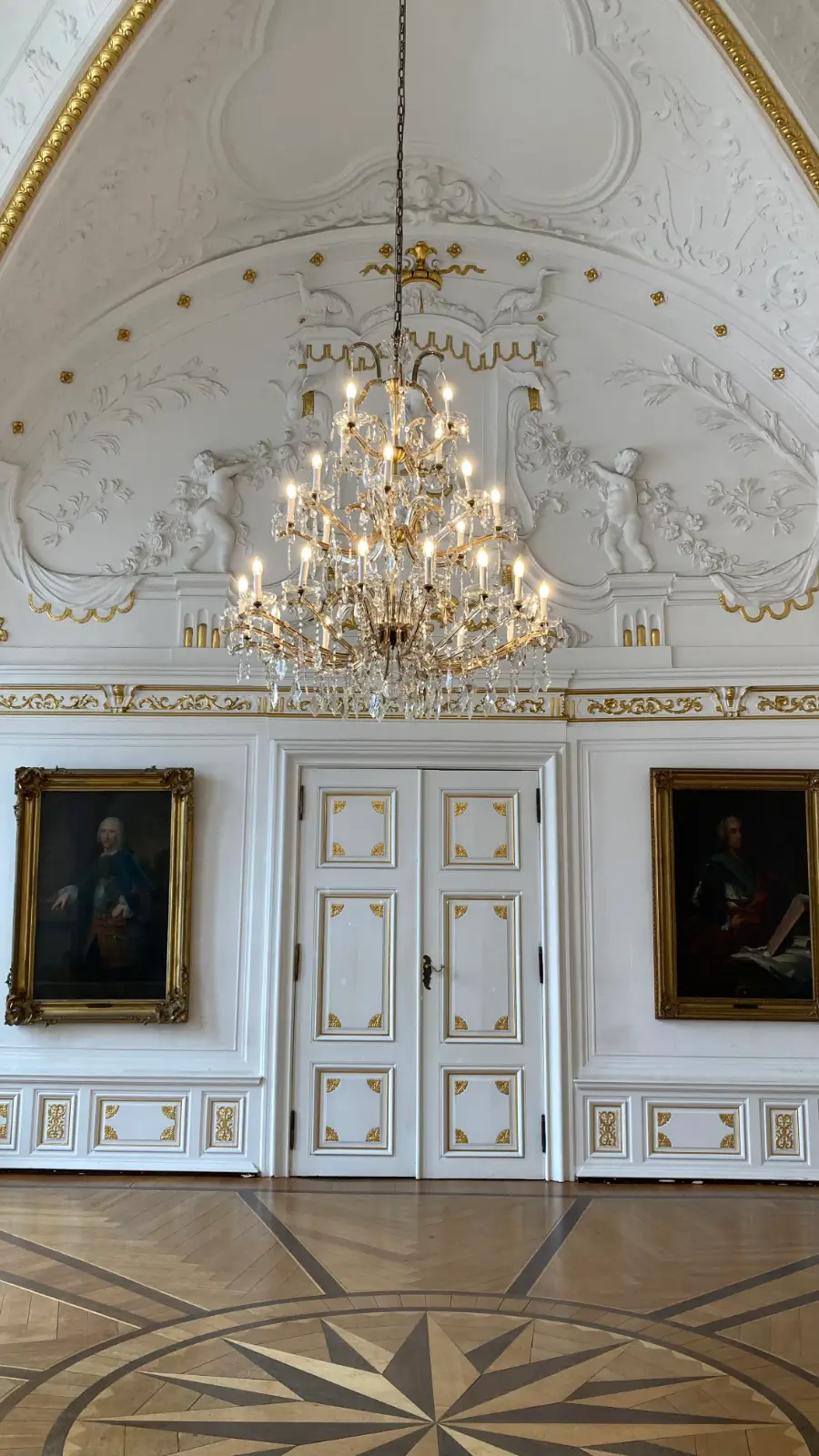 crystal chandelier in a paneled room