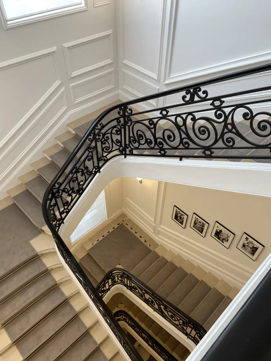 staircase with wrought iron railing