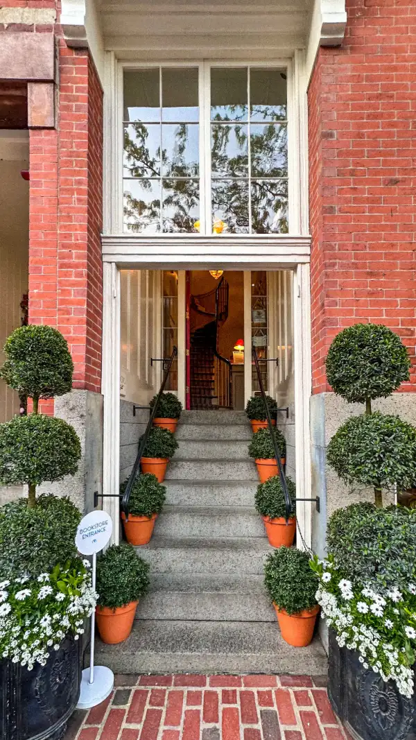 front steps lined with topiaries