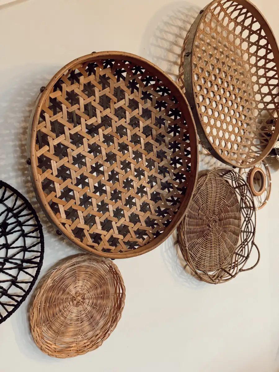 woven baskets hung on a wall