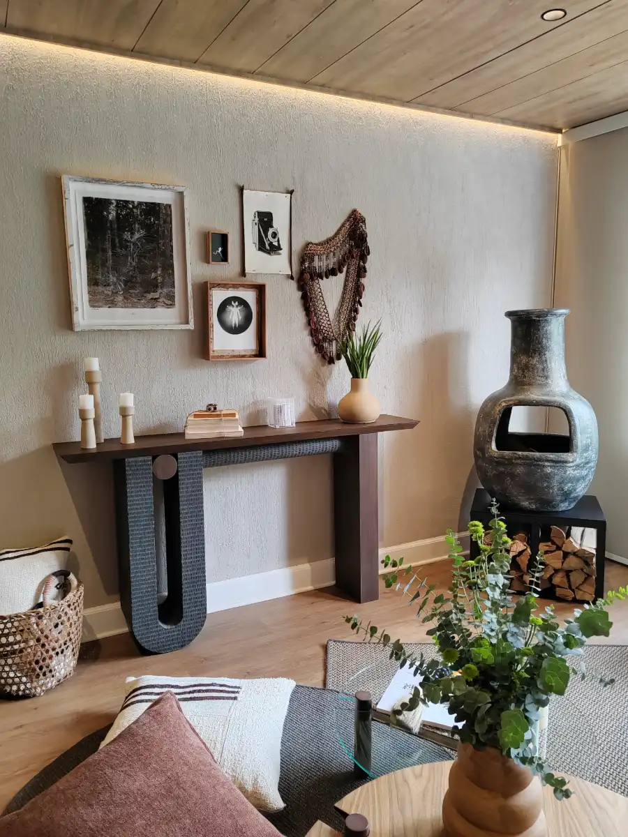 console styled with art and plants