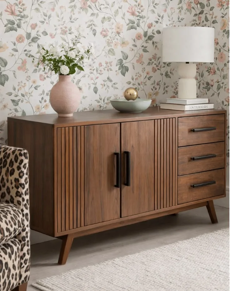 Walnut fluted sideboard against floral wallpaper